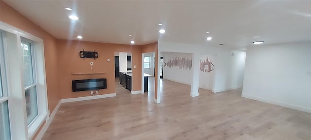 unfurnished living room featuring light hardwood / wood-style floors