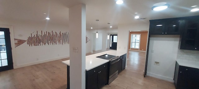 kitchen featuring electric stove and light hardwood / wood-style floors