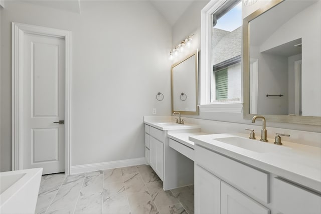 6300 Whitebrush Pl, Fort Worth, TX 76123 - full bath featuring vanity, marble finish floors, vaulted ceiling, a bath, and baseboards