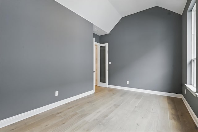 6300 Whitebrush Pl, Fort Worth, TX 76123 - unfurnished room featuring light wood-type flooring, vaulted ceiling, and baseboards