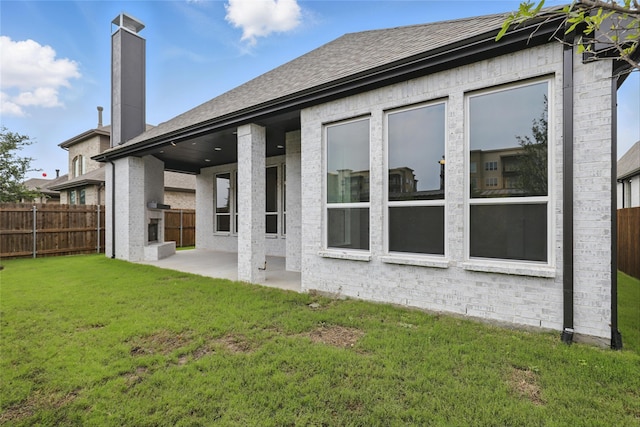 6300 Whitebrush Pl, Fort Worth, TX 76123 - back of house featuring a patio, a chimney, roof with shingles, and brick siding