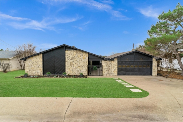 single story home featuring a garage and a front lawn