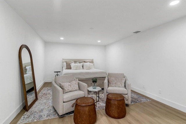 bedroom with hardwood / wood-style flooring