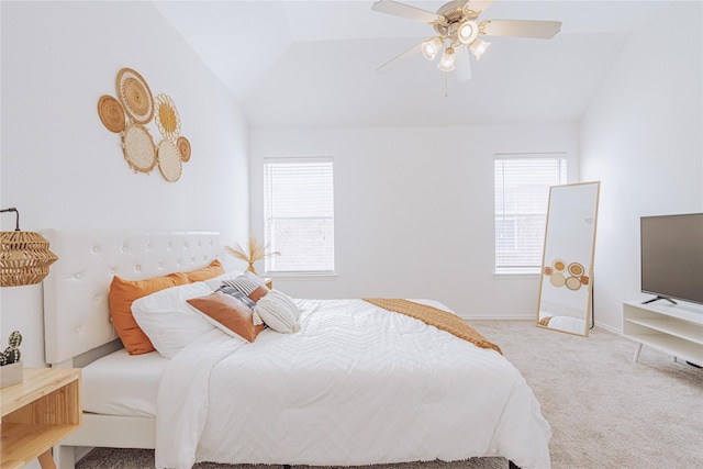 carpeted bedroom featuring vaulted ceiling and ceiling fan