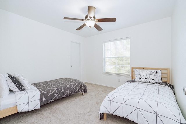 bedroom featuring ceiling fan and carpet floors