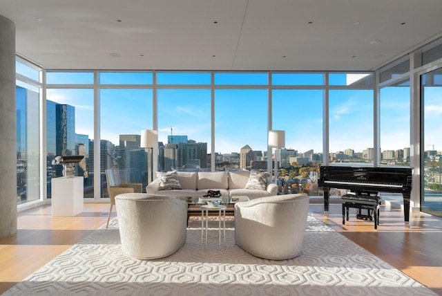 interior space with floor to ceiling windows and light hardwood / wood-style flooring