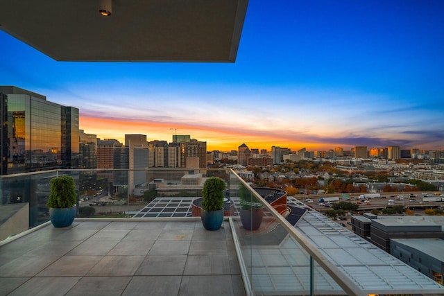 view of balcony at dusk