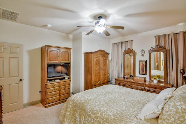 bedroom with light colored carpet and ceiling fan