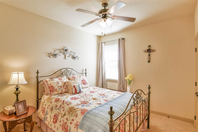 bedroom with light carpet and ceiling fan