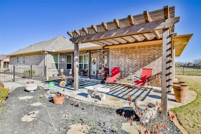 back of house with a pergola and a patio area