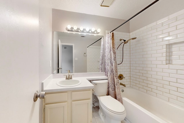 full bathroom featuring vanity, toilet, shower / tub combo, and a textured ceiling