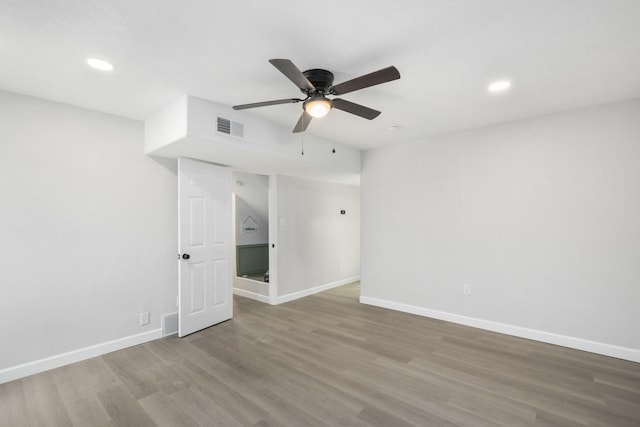 unfurnished room featuring ceiling fan and light hardwood / wood-style floors