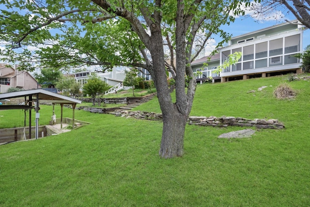 view of yard featuring a sunroom