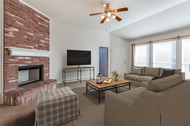 carpeted living room featuring ceiling fan, lofted ceiling, and a fireplace