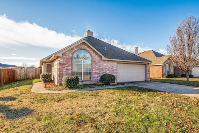 view of front of house featuring a garage and a front yard