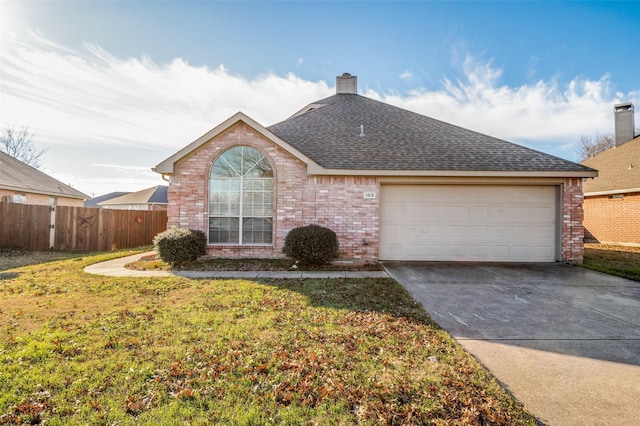 view of front of home with a garage and a front yard