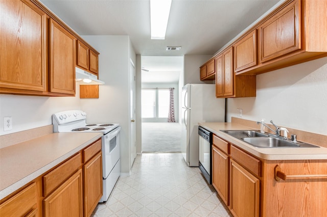 kitchen with electric range, sink, and dishwasher