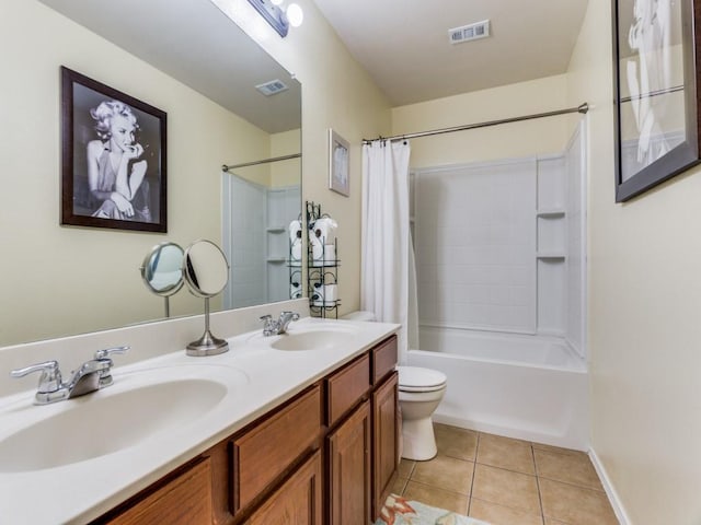 full bathroom featuring tile patterned flooring, vanity, shower / tub combo, and toilet