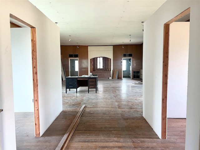 hall with hardwood / wood-style flooring