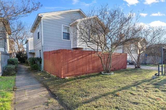 view of home's exterior with a lawn