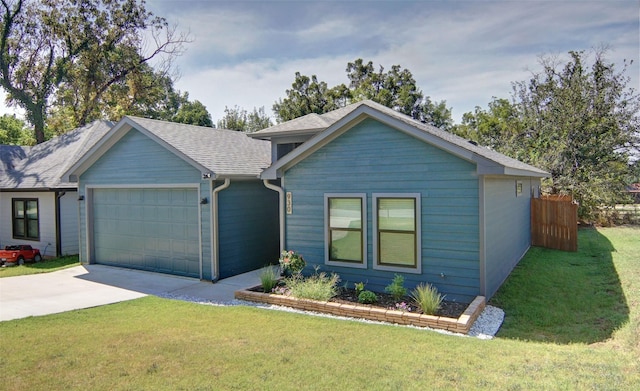 view of front facade featuring a garage and a front yard