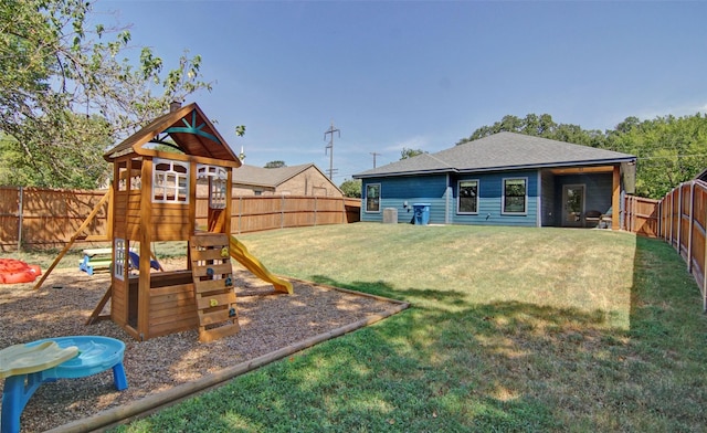 view of playground with a lawn