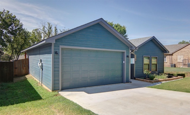 view of front of home featuring a garage and a front yard