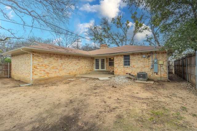 back of property with a patio and central AC unit