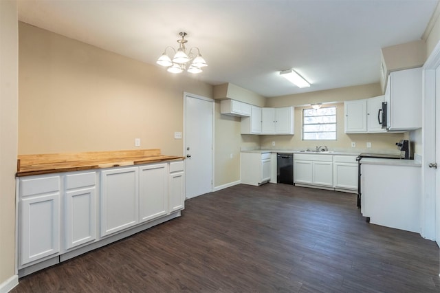 kitchen with dark hardwood / wood-style floors, sink, white cabinets, hanging light fixtures, and stove