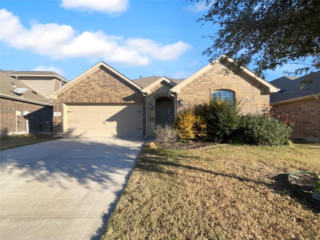 view of front of house with a garage and a front yard