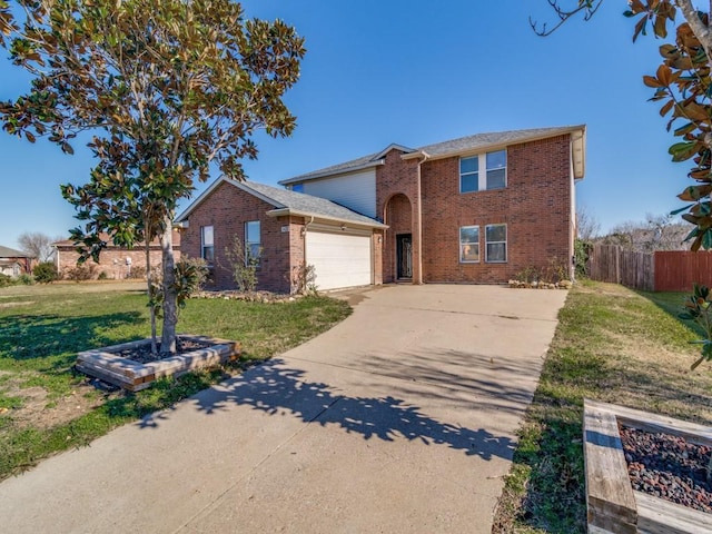 view of front of home featuring a garage and a front lawn