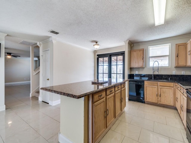 kitchen featuring black appliances, crown molding, sink, ceiling fan, and a kitchen island