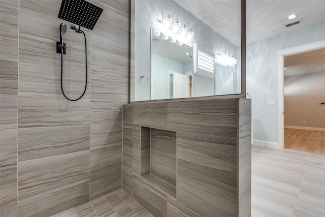 bathroom featuring tiled shower