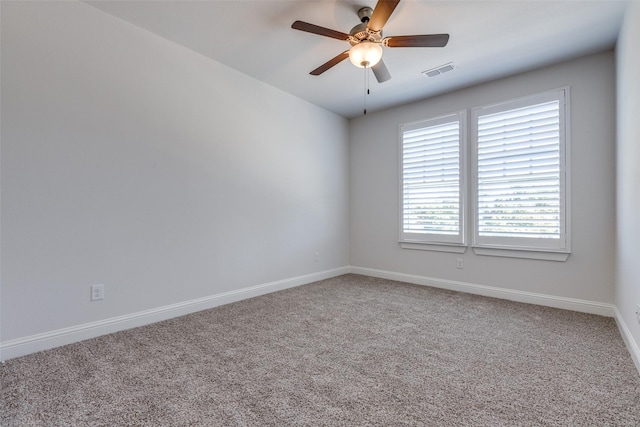 unfurnished room featuring carpet floors and ceiling fan