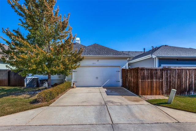 view of front of home with a garage and a front yard