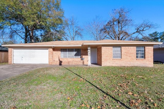 ranch-style home featuring a garage and a front lawn