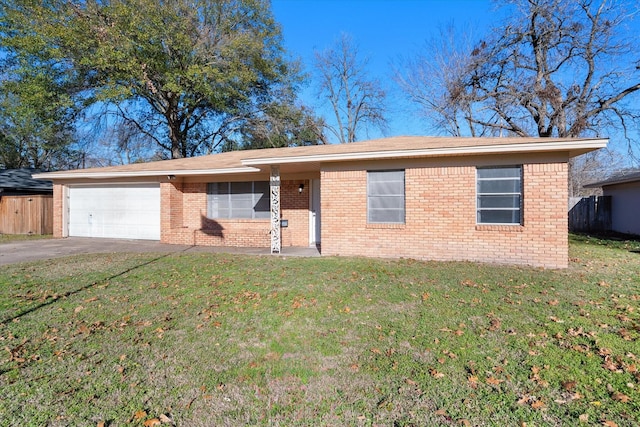 ranch-style home with a garage and a front lawn