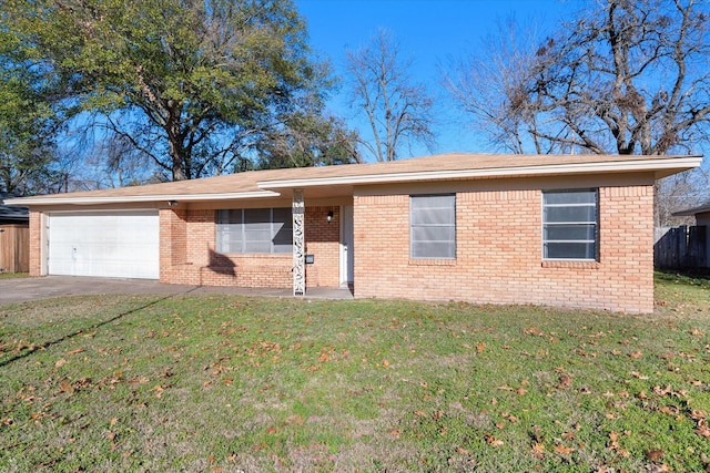 ranch-style home with a garage and a front lawn