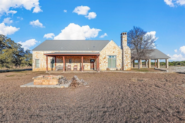 back of property featuring a patio