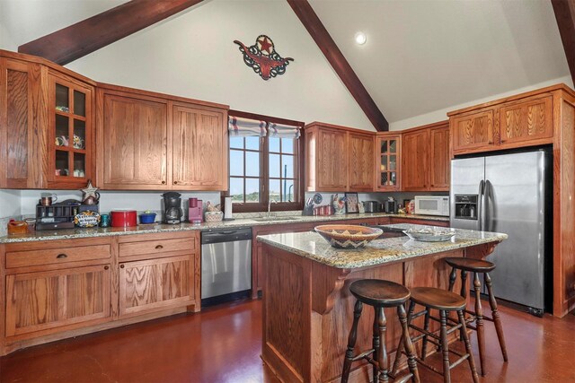 living room with beam ceiling, a stone fireplace, high vaulted ceiling, and indoor bar