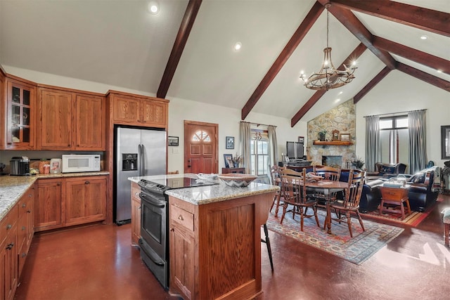 kitchen with stainless steel fridge, black electric range oven, light stone counters, and high vaulted ceiling