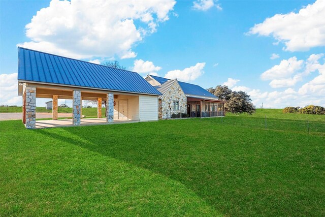 view of front of home with a sunroom