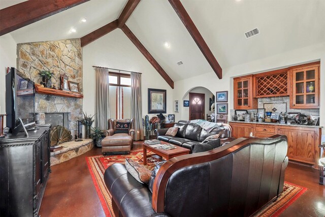 living room featuring dark wood-type flooring, high vaulted ceiling, a notable chandelier, beamed ceiling, and bar area