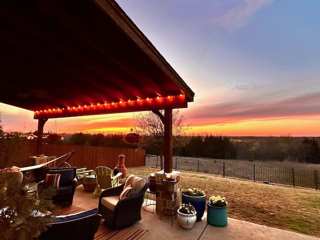 view of patio terrace at dusk