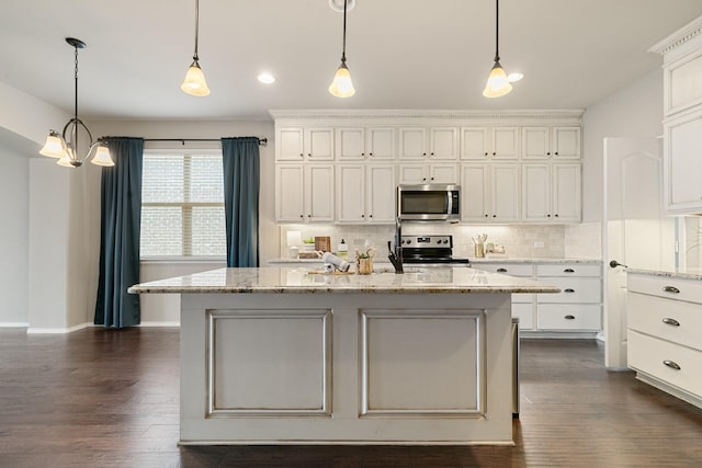 kitchen featuring stainless steel appliances, dark wood-type flooring, tasteful backsplash, and white cabinetry