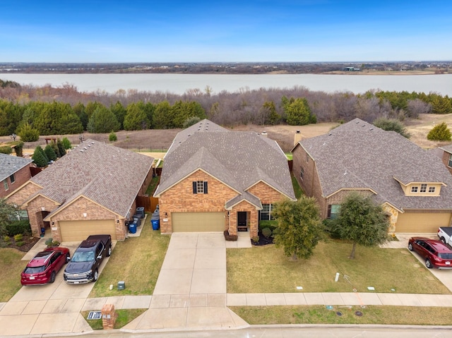 birds eye view of property featuring a water view