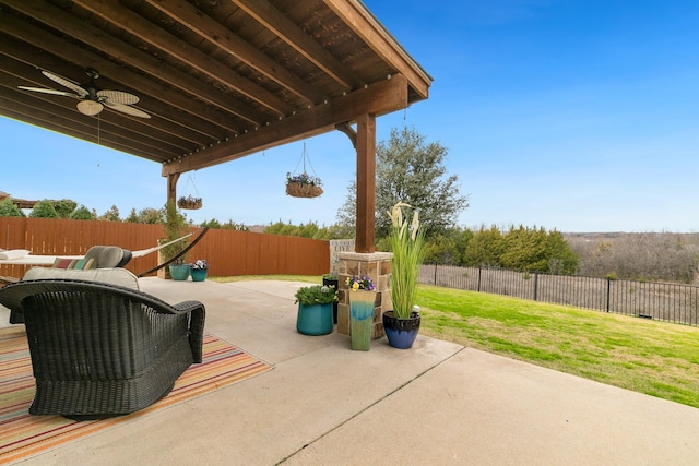 view of patio with a ceiling fan and a fenced backyard