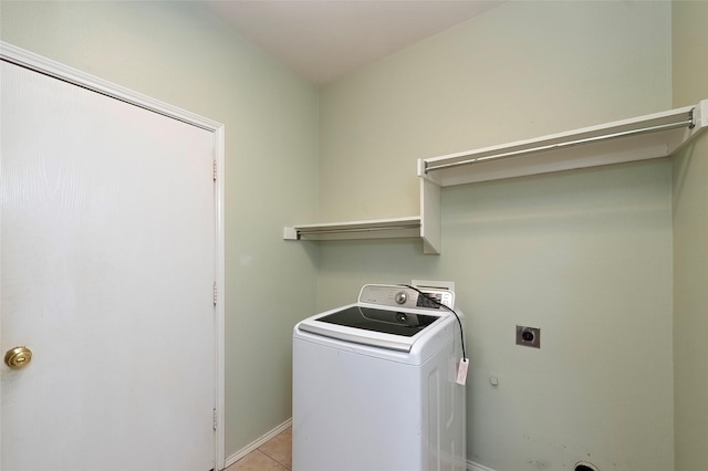 washroom with washer / clothes dryer and light tile patterned floors