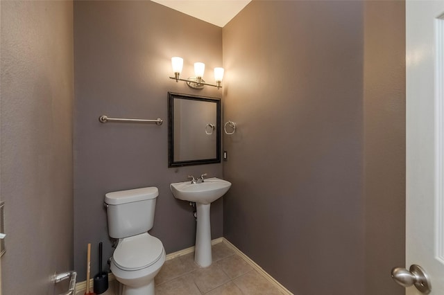 bathroom featuring tile patterned floors and toilet