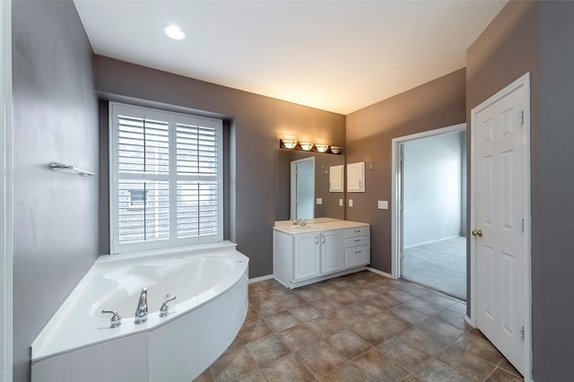 bathroom with vanity and a bathtub